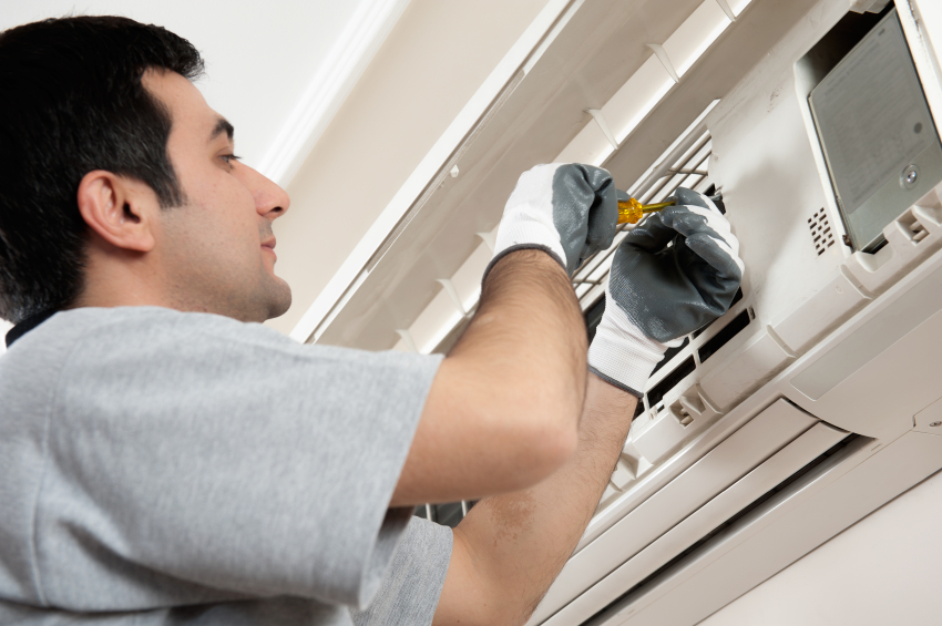 HVAC technician installing ductless mini-split in Colorado home